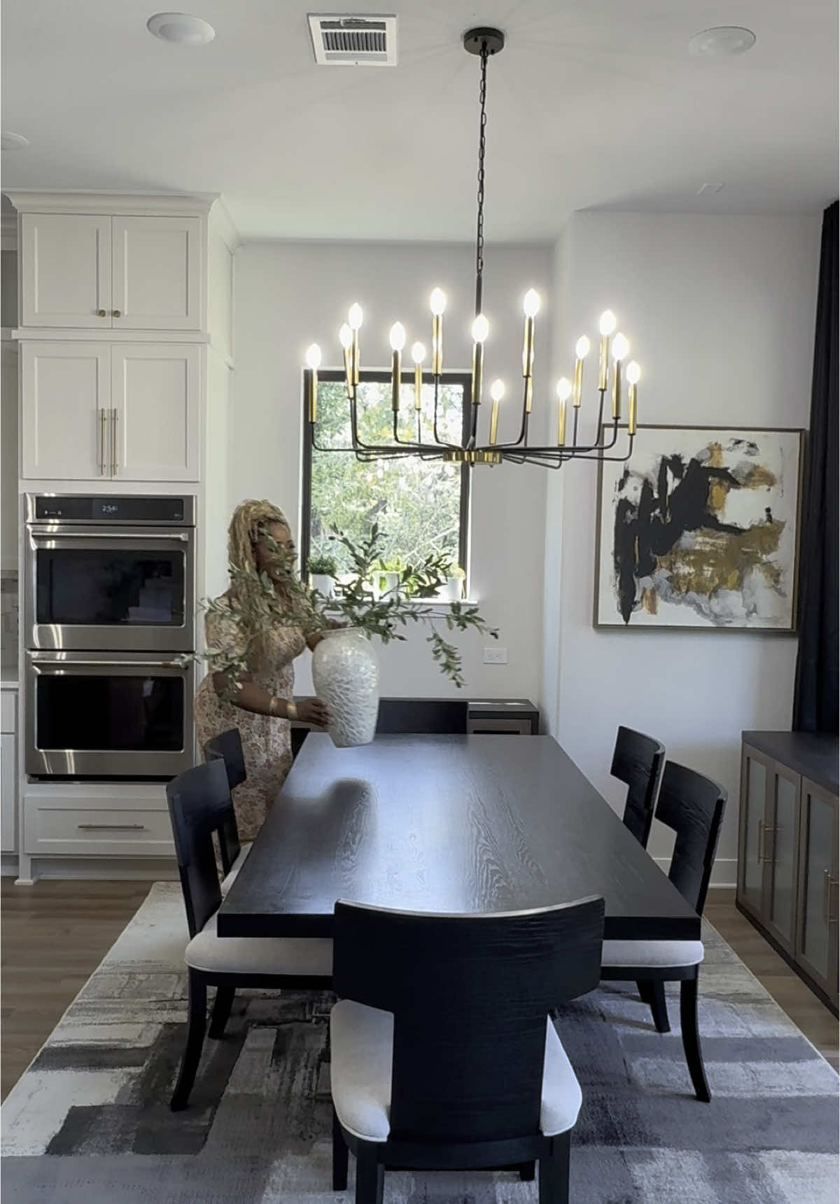 ✨ Comment “breakfast nook” if you want me to DM you the links to everything we styled in here! Antwan and I have been working on turning this house into a real home, and our breakfast nook is finally coming together. We brought in a gorgeous new dining table set, laid down a cozy rug, added cabinets for extra charm, hung drapes, wall décor, and topped it off with a chandelier that completely elevated the space. It’s giving warm, welcoming, and phenomenal! 🏡✨ Would you spend most of your family meals here or save it just for special moments?