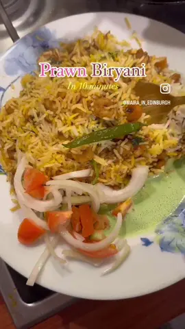 RECIPE :  Prawn Biryani ready in 10 minutes: Take oil, sauté onion, add all the garam masalas (tez pat, badyan phool, sabit kali mirch, sabit zeera, laung, sabit dhania). Let the onion become brown and add ginger garlic paste.  Now make tomatoes and green chillis paste and add it to bhoonofy. Add masalas including salt, pisi laal mirch, pisa dhania, garam masala, haldi, fish biryani masala.  Cook it nicely. Now add cooked prawns (you can also use uncooked ones) and stir on high flame.  Now you know the drill, rice layer; all the garnishing, prawn curry layer, rice layer again garnishing and tadda it’s ready in ten minutes!!!  In garnish I used fried onions, tomatoes slices, dhania, green chillis, orange food color. Enjoy!!! #pakistanidish #biryani #prawnbiryani #prawnrice #pakistani_tik_tok 