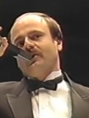 Mean Gene Okerlund presents Howard Finkel with a plaque commemorating his 10 years of service. (MSG January 19, 1987)