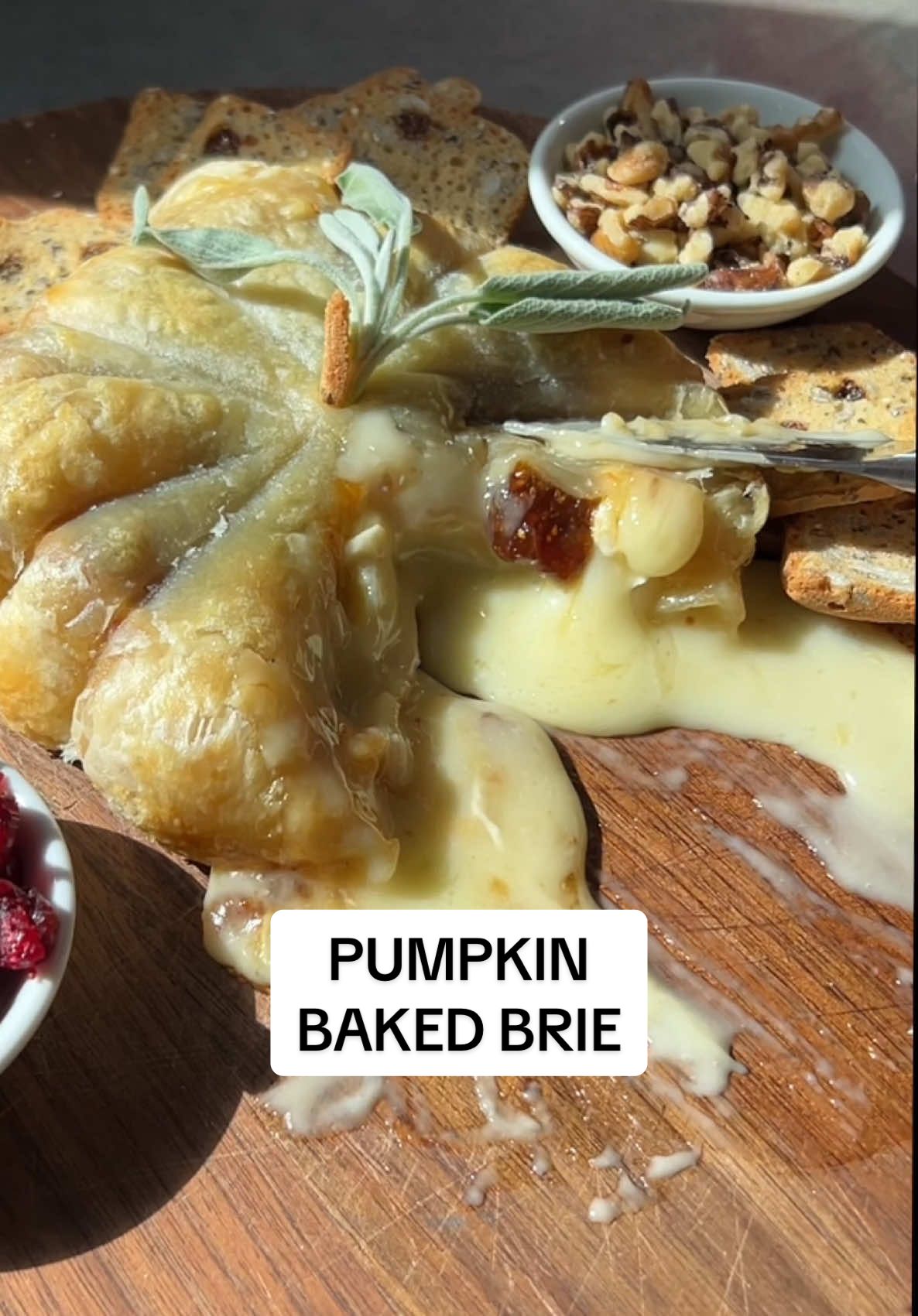 BAKED BRIE SEASON IS HERE 😍🧀 It’s the time of the season where melty baked cheese will now become a staple in your diet 🎃🍂🧀  This is perfect to make as an appetizer going into fall hosting season, girls night in, Halloween parties or Thanksgiving!  You can find details on how to make this below 🫶🏻 What you’ll need:  🧀 brie cheese wheel 🧀 puff pastry sheet  🧀 fig jam 🧀 baking twine  🧀 egg (egg wash)   Heat oven to 350. On a baking sheet, lay out a sheet of puff pastry. Add fig jam in the middle and place your brie cheese wheel in the middle. Wrap pastry around the brie cheese like a little present. Then cut 5 pieces of bakers twine and wrap each piece around the puff pastry to make the pumpkin shape. Tie each piece of bakers twine as you wrap them around (be sure to bake the Brie with the bakers twine on). Flip brie over and brush the top with egg wash. Bake for 20 minutes (or until the top is golden brown). Once out of the oven let cool for at least 5 minutes and then cut off the baking twine. I used a piece of a cracker and sage leaf stem for the top of it. Serve with your choice of crackers, apples, nuts and ENJOY! 🧀 A must make this fall and follow me for more easy cheesy appetizer ideas! 🧀🍂🎃🍁 #bakedbrie #cheese #Foodie #appetizers #EasyRecipe #briecheese #fallfood #thanksgivingdinner #halloweenfood #recipeoftheday 