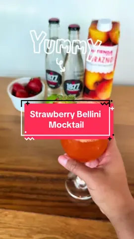 This strawberry Bellini mocktail is the perfect sip for a hot day 🍹  🔗 recipe in bio  #mocktail 