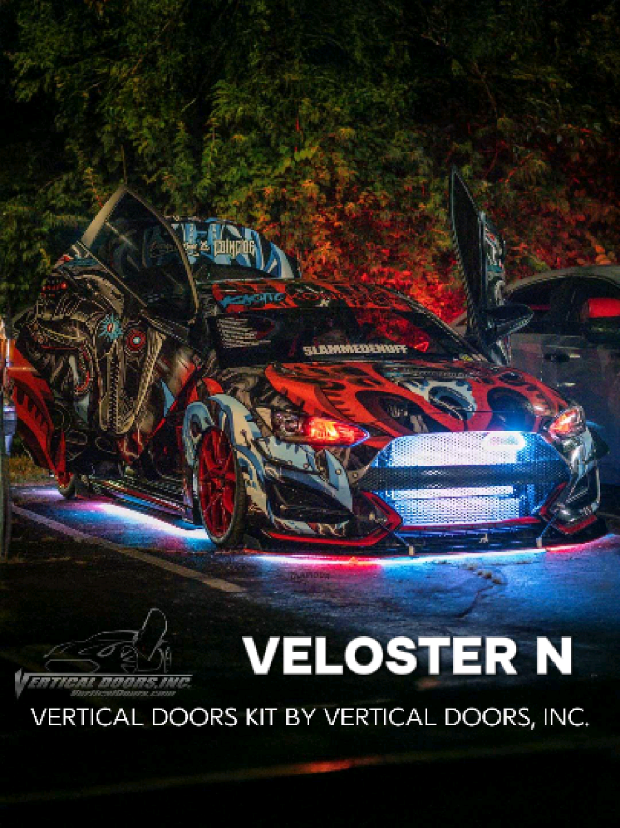 @indys_vnraptor Hyundai Veloster N from Indiana, wrapped, slammed, tuned, fully modded and of course showing off Lambo Doors Conversion kit from Vertical Doors, Inc.  At Vertical Doors, Inc., we’re always excited to see how our customers transform their rides. One standout build comes from @indys_vnraptor in Indiana, a fully wrapped, slammed, tuned, and modded 2020 Hyundai Veloster N, now taken to the next level with our Lambo Door Conversion Kit. 📸 Captured by @indystscene and @glamourandgears this Veloster N build perfectly blends aggressive performance styling with the show-stopping presence of our Vertical Lambo Doors. With support from respected sponsors including @velossa_tech, @coincidedesign, @wrapnredbeard, @socalgarageworks, @lth_laserdesignz, and @indypowdercoating, this car represents the best in custom automotive culture. Vertical Doors Kit for the Hyundai Veloster (2011–2023) We are proud to offer direct bolt-on hinge conversion kits for both generations of the Hyundai Veloster: VDCHYVEL11 - 1st Gen (2011 - 2017/2018) and VDCHYVEL19 -  2nd Gen (2019 - 2023) Compatible with ALL Veloster trim levels, including: Veloster Turbo, Veloster Turbo R-Spec, Veloster Turbo Rally Edition, Veloster Turbo Ultimate, Value Edition, 2.0, 2.0 Premium, 2.0 Premium DCT, Turbo R-Spec, Turbo, Turbo Ultimate, and N. Whether you drive a daily commuter or a fully tuned show car, our kits are precision-engineered for everyday use. Built in the USA with over 20 years of proven reliability, we are the only manufacturer of Vertical Lambo Doors and ZLR Door Conversion Kits in the country. Our kits are also widely known as Lambo Doors, Vertical Doors, Scissor Doors, Butterfly Doors, Wing Doors, and Door Conversion Kits, no matter what you call them, we set the standard. Why Choose Vertical Doors, Inc.? • 100% bolt-on design (no welding required) • Trusted by enthusiasts, shops, and professional builders worldwide • Local, nationwide, international, and mobile installation options Protect Your Investment ⚠️ Before purchasing from a competitor, we strongly recommend checking their reputation on BBB, Google Reviews, and enthusiast forums. Many low-cost alternatives cut corners on quality, safety, and customer support. At Vertical Doors, Inc., you can trust that you’re getting the original and best in the industry. 👉 Like what you see? Show some love, like, tag, #verticaldoors #lambodoors and share this post, and don’t forget to mention @verticaldoors for a chance to be featured! Want to Get Featured? Already rocking a set of Vertical Doors? We’d love to showcase your ride! Share your photos, videos, event coverage, or car show highlights with us: Check out https://verticaldoors.com/pages/media-submission-requirements for details Or email: Social@verticaldoors.com • Ready to Elevate Your Veloster? Contact us today for sales, installation, or dealer inquiries: 951.245.8669 | Sales@verticaldoors.com 🔥 Stay Connected with Us: 🌐 https://qrco.de/VDI-Social-Media #VelosterLamboDoors #VelosterVerticalDoors #Velosterdoorconversion                 