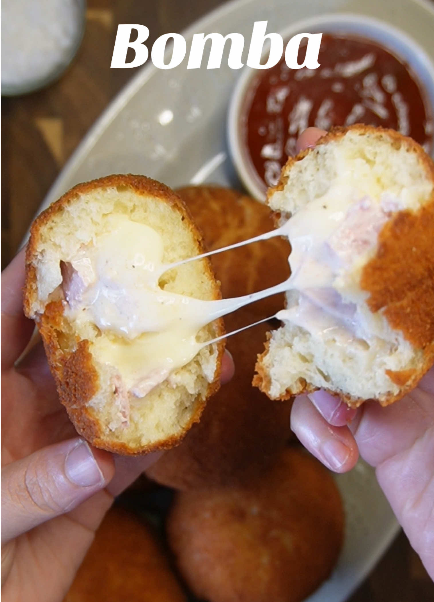 Follow me for more delicious recipes! ☺️ Tag a friend who loves cheese and crispy food ❤️ Fried Cheese & Ham Bombes 💥💥 Ingredients 	•	330 g flour (2 ¾ cups) 	•	150 ml milk (⅔ cup) 	•	60 g oil (¼ cup) 	•	1 egg 	•	7 g yeast (1 packet, 2 ¼ tsp) 	•	1 tsp sugar 	•	1 tsp salt Filling: 	•	Gouda cheese (cubed) 	•	Cream cheese (2–3 tbsp) 	•	Ham / turkey (Pute) / bacon / chicken slices, chopped (your choice) For coating & frying: 	•	½ cup milk 	•	1–2 cups breadcrumbs 	•	natural Oil for deep frying 🌶️Prepare filling: Cut ham (or other cold cuts) into small pieces. Mix with shredded Gouda and a little cream cheese to bind. 🥣Instructions 	1.	Make the dough: 	•	Mix  milk and oil sugar, yeast and Egg  	•	Add flour, salt . Knead until smooth. 	•	Let rise 1 hour, until doubled. 	2.	Shape the bombes: 	•	Divide dough into small balls 8 pieces  	•	Flatten, add some ham Gouda cheese  	•	Seal tightly into round balls. 	3.	Coat: 	•	Dip each ball briefly in milk. 	•	Roll in breadcrumbs until well coated. 	4.	Fry: 	•	Heat oil to 170–180°C (340–350°F). 	•	Fry bombes in batches until golden brown (about 3–4 minutes). 	•	Drain on paper towels. 	Enjoy your Gooey cheese inside, crispy outside Bomba 💥🤤 #fyp #asmr #FoodTok #bomba #Recipe 
