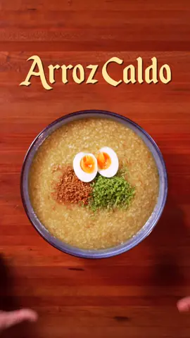 🇵🇭 Arroz Caldo | Soups So Good It Can Cure Any Sickness Ep. 11 INGREDIENTS: Arroz Caldo: - 1kg bone-in chicken thighs - 1 cup glutinous rice (malagkit) - 1 cup regular white rice - 1 onion, chopped - 10-12 garlic cloves, minced - 1 whole ginger, julienned - Chicken oil (optional) - 6-8 cups chicken stock (or until pot is filled) - 2 tbsp fish sauce (or to taste) - Salt and pepper, to taste - 1 tbsp of kasubha Toppings: - Hard-boiled eggs - Fried garlic bits - Spring onions INSTRUCTIONS: - Start by searing your chicken thighs in neutral oil (or in this case we used chicken oil) for about 3-5 minutes on each side. Remove chicken and place on a wire rack. Set aside for later.  - In the same pan or pot add your chopped onions, garlic and ginger and saute using the excess oil until softened and fragrant.  - Add your rice and chicken stock and mix. Add back your chicken thighs and season with fish sauce, kasubha, and pepper. Cover your pot which should be on a gentle simmer for about 25-35 minutes or until the rice is cooked. - Serve with spring onions, eggs, and crispy garlic bits and enjoy! #asmr #ASMRCooking #Soups 