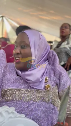 Hajjat Kuluthum attending Baby Gloria introduction ceremony