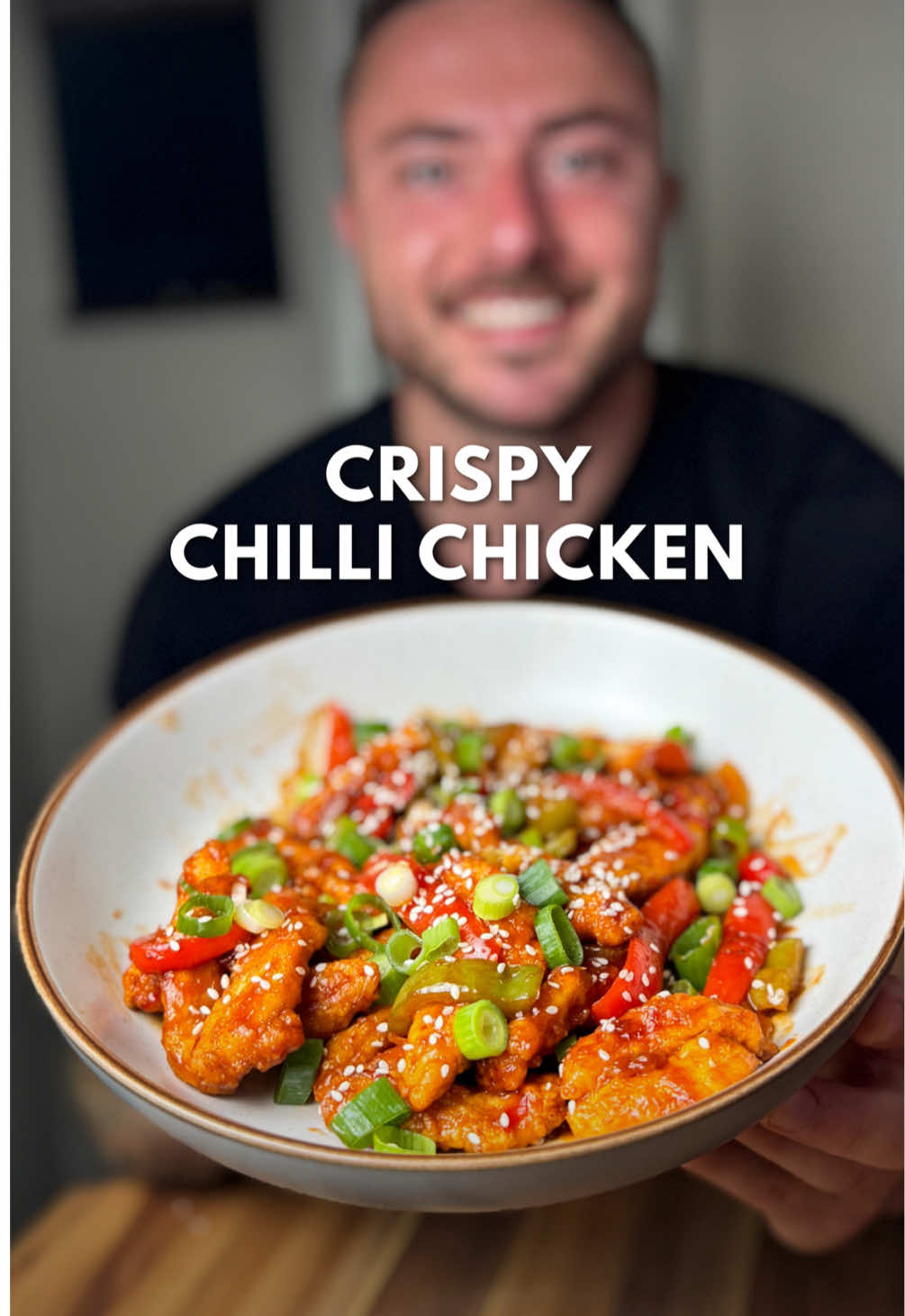 Crispy Chilli Chicken 🐓  Ingredients (2 servings): 360g chicken breast 1 egg 2 tbsp cornflour 1 tsp garlic powder 1 tsp onion powder  1 tsp paprika 1/2 tsp white pepper  Salt 1/2 onion 1/2 red pepper 1/2 green pepper  1/2 red chilli 2 spring onions 1 tsp sesame seeds Spray oil  For the sauce: 1 tbsp soy sauce 1 tbsp rice vinegar 1 tbsp sweet chilli sauce  1 tbsp no added sugar ketchup  1 tsp honey  2 garlic cloves 1 tsp ginger  Splash of water ——— Method: 1. Slice the chicken into thin strips. Beat the egg in a bowl, then add the chicken. In another bowl, add the cornflour, garlic powder, paprika and salt. Remove excess egg from the chicken, then coat in seasoned cornflour. 2. Place the chicken in your air fryer, spray with oil, air fry for 12-15 minutes at 200 degrees celcius until golden and crispy. 3. Slice the pepper and onion into strips, slice the chilli, finely grate the garlic and ginger. 4. Fry the peppers and onion for 5 minutes, add the chilli, garlic and ginger, cook for 1 minute. Add all the sauce ingredients, mix well, then bring to a light simmer. 5. Add the crispy chicken, mix until it’s fully coated, then garnish with sliced spring onion and sesame seeds. Then enjoy, lovely! #chinesefood #lowcalorierecipes #familymeals #DinnerIdeas 