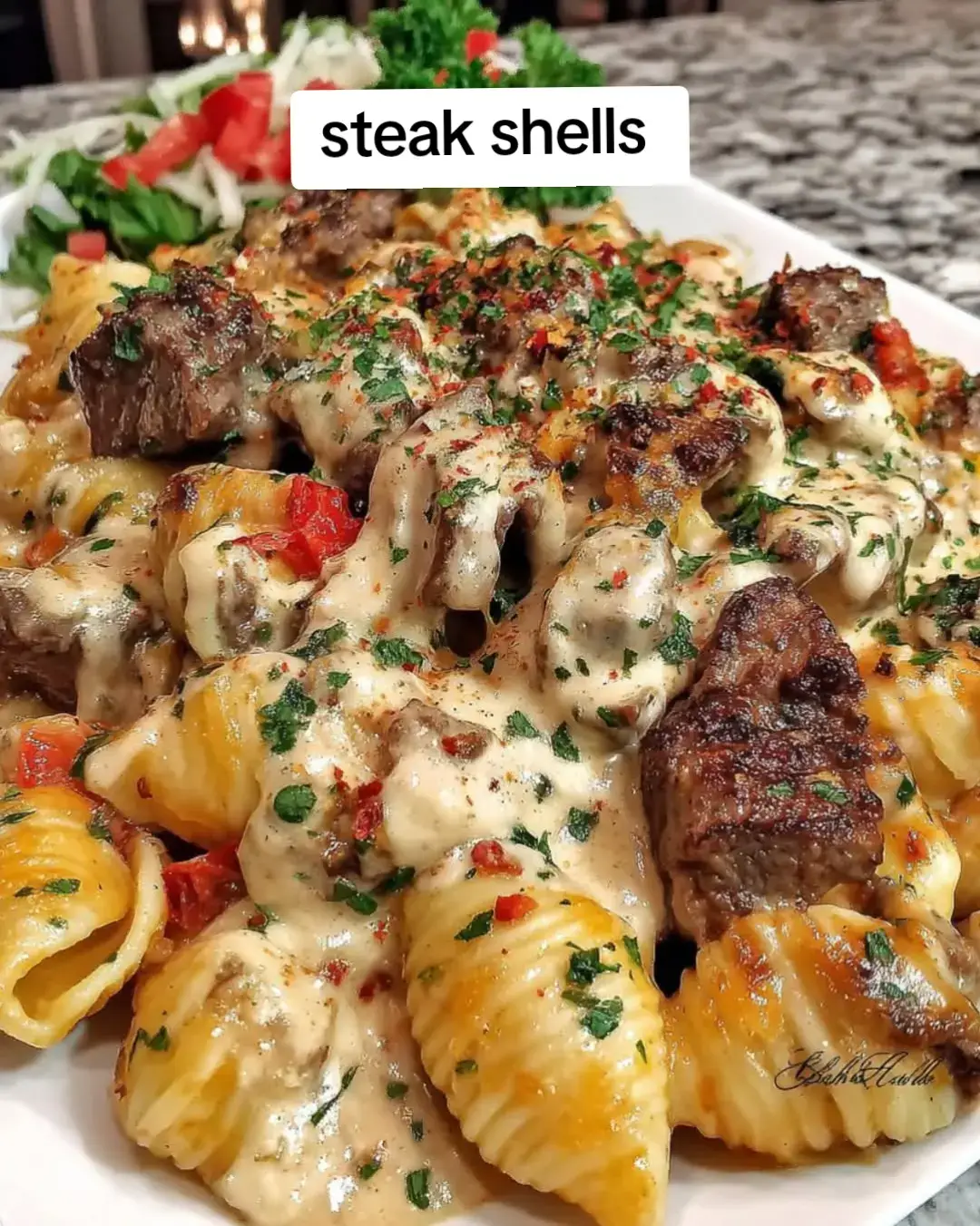 Colby Jack Steak Shells with Garlic and Herbs 🧄🥩🧀🌿🍝🔥 Tender, juicy steak bites and shell pasta tossed in a velvety orange Colby Jack cheese sauce, infused with garlic and fresh herbs. Creamy, savory, and ready in 30 — this skillet is your new cheesy steak-night favorite! 🥩🧄🧀🍝 Ingredients: 12 oz medium pasta shells 1 lb sirloin or ribeye steak, cut into bite-sized pieces Salt & black pepper, to taste 1 tsp garlic powder 1 tsp Italian seasoning 1 tbsp olive oil 2 tbsp butter 4 cloves garlic, minced ¾ cup beef broth 1 cup heavy cream 1 ½ cups shredded Colby Jack cheese (orange blend) 1 tbsp chopped fresh parsley (plus more for garnish) Optional: pinch of crushed red pepper for heat Instructions: Cook the Pasta: 1️⃣ Boil shells in salted water until al dente. Drain and set aside. Sear the Steak: 2️⃣ Season steak bites with salt, pepper, garlic powder, and Italian seasoning. 3️⃣ Heat olive oil in a large skillet over medium-high heat. 4️⃣ Sear steak bites 2–3 minutes per side until browned and cooked to your liking. Remove and set aside. Make the Garlic Herb Sauce: 5️⃣ In the same skillet, melt butter and sauté garlic for 1 minute until fragrant. 6️⃣ Pour in beef broth and heavy cream. Bring to a gentle simmer. Melt the Cheese: 7️⃣ Reduce heat to low and stir in Colby Jack cheese until smooth and creamy. 8️⃣ Add fresh parsley and stir to combine. Bring It All Together: 9️⃣ Return steak and shells to the skillet. Toss until coated in the cheesy garlic herb sauce. Serve: 🔟 Garnish with extra parsley (and a sprinkle more Colby Jack if you dare). Serve hot! Prep Time: 10 minutes Cook Time: 20 minutes Total Time: 30 minutes Servings: 4 🧄🥩🧀 Creamy, garlicky, herby, and loaded with Colby Jack goodness — this steak pasta is the definition of comfort food bliss! 🍝🔥 #creatorsearchinsights #fyp #viral #fypシ 