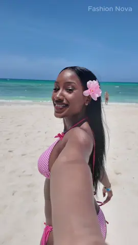 tropical island + @fashionnova bikini + a flower in my hair = happy me 💕 Search: “Luna Gingham & Bows 2 Piece Bikini - Pink/combo” Also why someone said I’m running like CJ from San adreas bye 