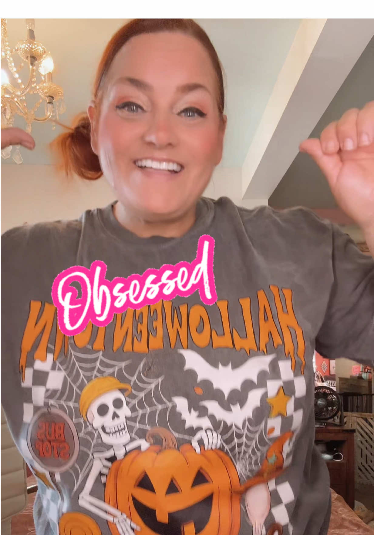 How stinking cute is this Halloween T-shirt? I absolutely love the skeleton and bats. #halloweenshirt #halloweenshirts 
