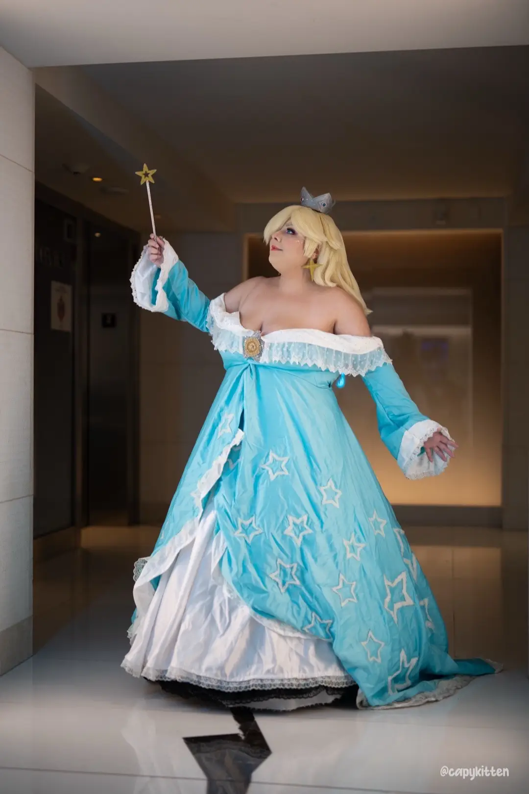 For #otakon2025, I recently restyled my Rosalina wig after getting some amazing feedback from judges from craftsmanship contests I was in. If you go back and watch my first Rosalina video, there’s a significant difference. It’s so amazing to see the progress after 2-3 years! I’ve also lost 40 pounds since I first made this cosplay. 🥹 I’m hoping I can continue to improve my craftsmanship!  Full Rosalina cosplay made by me! Would folks like to see the progress of how I made it years ago?  First photo credit goes to Capykitten! ( @capykitten ) #rosalinacosplay #supermariogalaxy #rosalia #princessrosalina
