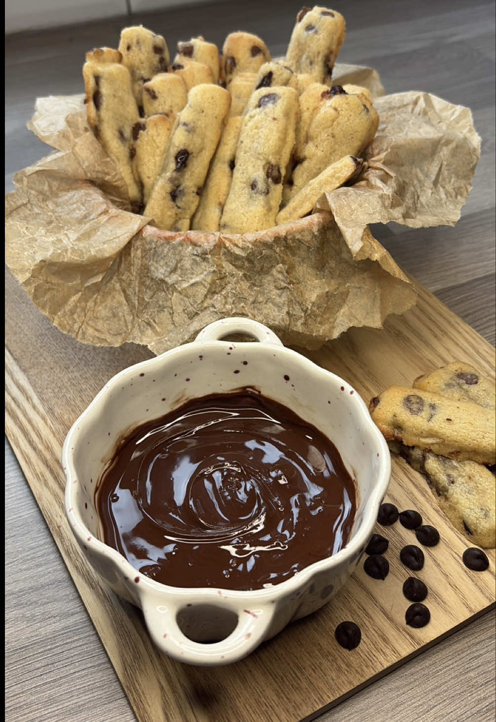 Chocolate chip cookie fries  Recipe from @www.archersfood.com  Ingredients 120 g unsalted butter (browned if you’d like that nutty richness) 30 g brown sugar 60 g granulated sugar 1 egg ~160 g all-purpose flour ½ tsp baking powder 150 g milk chocolate chips  Instructions Brown the butter (optional): Melt butter in a saucepan, cook until lightly browned and fragrant, then let it cool slightly. Mix base dough: In a bowl, cream the browned (or regular softened) butter with both sugars until fluffy. Beat in the egg until well combined. Stir in flour and baking powder until just mixed. Fold in the chocolate chips. Shape the “fries”: Turn the dough out onto parchment paper and shape or roll into a rectangle approx. ½ inch thick. Slice into thin sticks—think the size of French fries. Chill the fries (freezing time): To ensure they keep their fry shape and don’t spread too much, chill in the freezer (or fridge) for 30 minutes to 1 hour before baking. Bake: Preheat oven to 350 °F (175 °C). Arrange the chilled cookie fries on a baking sheet lined with parchment. Bake for 10–12 minutes, until the edges are lightly golden but centers stay soft. Finish & serve: Let them cool slightly—they’ll firm up as they rest. Serve warm with a dipping sauce such as Nutella, caramel, or strawberry jam. #cookiesoftiktok #asmr #autumnbaking #cookierecipe #viral