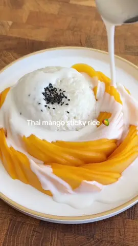 Thai Mango Sticky Rice 🥭  INGREDIENTS 1 cup Thai glutinous rice, rinsed then soaked overnight  SALTED COCONUT SAUCE 350ml Full-Fat Premium Coconut Cream (I use Kara UHT) 4 tbsp caster sugar (60g) 3/4 tsp salt (4.5g) TO SERVE 1 big fat juicy, sweet, RIPE, mango! Or 2 small Toasted sesame seeds, black sesame seeds or toasted mung beans (traditional) METHOD Rinse your glutinous rice 3 times (and yes- it has to be glutinous rice) and soak in water overnight and place your ripe mangoes in the fridge to chill. The next day, drain the rice and steam your rice in a sieve or bamboo steamer lined with muslin cloth for 30-40 minutes. While the rice is steaming, peel and cut your mangoes and return them to the fridge to keep cold - cut em chunky for a satisfying mouthfeel or slice thin and splay out for nice plating. Mix your coconut cream, sugar and salt in a small saucepan and heat on medium heat just until just hot through, about 3-4 minutes, then turn heat off. It will thicken slightly. Once the rice is cooked, transfer to a mixing bowl and pour over about 1/3 of the coconut cream and fold in carefully - you don’t want to mush the rice so try folding it in with more of a fluffing action. Reserve the rest of the coconut cream as a pouring sauce to serve with the dish. To plate, wet a small bowl with cold water (this helps rice not to stick when shaping the rice), then fill the bowl with the sticky rice and pat down to lightly compress rice into the bowl. Flip the bowl onto your plate to reveal a perfect dome of rice and serve with the cut mango. Sprinkle with toasted sesame seeds or toasted mung beans and serve with the extra sauce. #mangostickyrice 