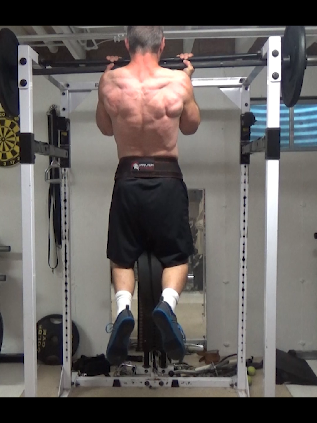 Barbell Clamp Weighted Chin-Ups (+70 lbs on waist)... this one is even tougher than the pull-up version I posted the other day.  Because the chin-up is a stronger movement than the pull-up, I decided to add some extra weight to challenge myself further. I've got a couple of 35 lb bumper plates on a dip belt (70 lbs total). This is like next-level fat bar work, because not only is your hand position wide open, your fingers and thumbs are being actively pulled apart by the weight. The thumb strength work is something you don't normally get much of in chin-ups and pull-ups...it's more fingers.  So I underhand pressed the bar up with it cradled in the thumb 