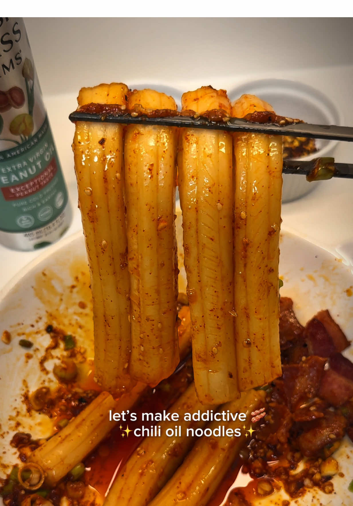 The most addictive noodle combo ever🍝 Chewy potato noodles coated in sizzling bacon chili oil 🥓🔥 Spicy, savory, chewy and oh-so satisfying 😮‍💨 This is your sign to make bacon chili oil noodles tonight 💗 📍Tag your noodle buddy & save this recipe for your next craving night! ✨Hailey’s Addictive Chili Oil Noodles Ingredients •	1 pack potato noodles •	2 strips bacon, sliced •	3 tbsp neutral oil (peanut, avocado, or vegetable) •	½ tbsp chili flakes •	½ tbsp chili powder •	2 cloves garlic, minced (about ½ tbsp) •	1 tbsp chopped scallions •	1 tsp sugar •	½ tsp chicken powder •	1 tbsp soy sauce •	½ tsp sesame seeds (optional) ⸻ Instructions 1.	Cook the potato noodles according to package directions. Drain and set aside. 2.	In a heatproof bowl, combine chili flakes, chili powder, garlic, scallions, sugar, and chicken powder. 3.	In a small pan, cook the sliced bacon with 3 tbsp neutral oil until the bacon is crispy and the oil is sizzling. 4.	Carefully pour the hot bacon oil over the spice mix — aim for the chili powder, garlic, and scallions for that irresistible sizzle. 5.	Add the cooked noodles into the bowl with the chili oil mixture. 6.	Pour in the soy sauce and toss until everything is evenly coated. 7.	Garnish with sesame seeds (if using), serve immediately, and enjoy 💗 ⸻ ✨ Tips: •	For a milder spice, use less chili powder. •	For a bolder, tangier kick, add a splash of extra soy sauce and a little Chinese vinegar. •	I used peanut oil for this recipe — it works beautifully, but you can substitute with avocado or vegetable oil. •	Potato noodles give the best chewy texture, but you can also substitute with udon or knife-cut noodles. #chilioilnoodles #asmrfood #mukbang #potatonoodles #fyp 