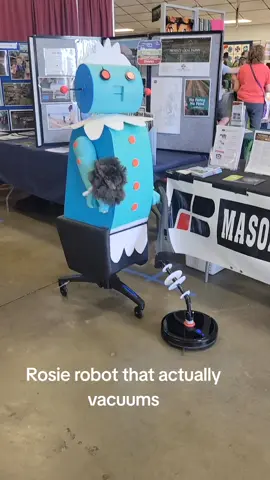 Rosie robot that is pulled by robot vacuum,  she actually cleans the floor, the future is here! lol#realrosietherobot 
