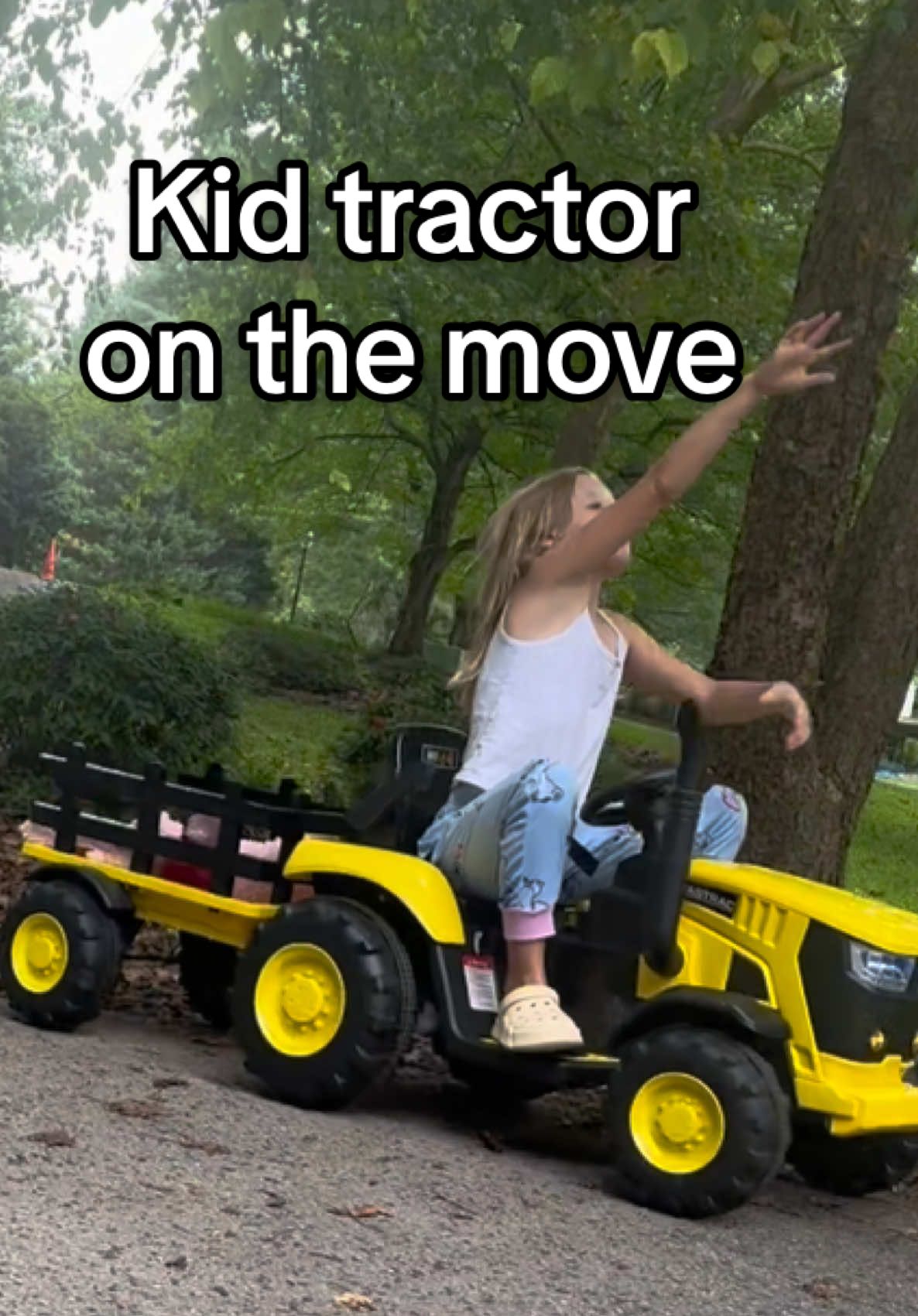Ride on Tractor with trailer that kids can steer themselves or an adult can take over with the remote control. #rideontoys #tractorforkids #giftideasforkids #RCCAR #outdoortoys @GARVEE JoyRide 
