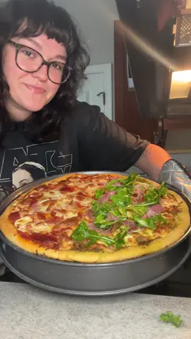 Home made pizza with yeast free homemade crust. Definitely will be making this recipe again.  Half was pepperoni and hot honey for my husband. Other half was pesto and prosciutto with arugula for myself.  Crust recipe: 2 Cups of Bread flour 3 T baking powder  1 t salt 3/4 cup water 1 T olive oil  Add your toppings of choice. Bake at 400 for about 20 minutes and enjoy  #pizza #homemade #Recipe #dinner #cooking 