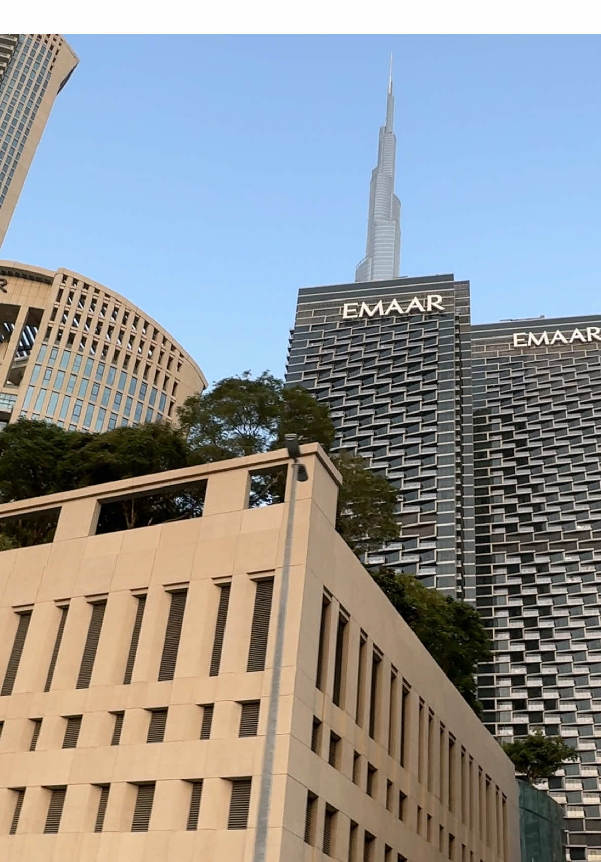 Part - 153 | While Driving Through Al Mustaqbal Street, We can view the the beautiful and stunning Skyscrapers 🏙️, built by the world 5th, biggest developer “Emaar” shows epic view and making downtown a vibrant place.  ✨🥳🫠🫶.  #emaar #downtown #burjkhalifa #dubai #evening @Emaar Dubai  