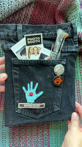 the back pocket of an artist’s jeans