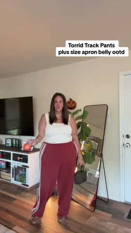 Replying to @Angelina Fox I also got the Torrid pants in this other color but they didn’t have a top that I liked to match so this is how I styled those wide leg track pants today! I almost like this color better on me. Which do you like? #plussizefashion #y2kstyle #apronbelly #apronbellybaddies #plussizeootd @Torrid 