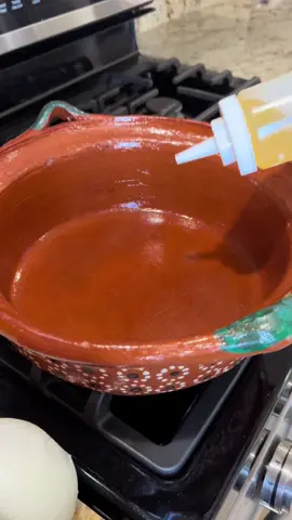   African peanut butter soup 😍 also known as groundnut soup is a rich and creamy comfort food popular throughout West Africa.  Recipes vary widely by region and household, versions ranging from hearty stews to thinner soups.  I have been cooking it for my kids since they were toddlers and they have always loved it 🤍 here’s how I make using no palm oil, it’s a  recipe with simple ingredients but a little technique, let everything cook slowly and melt on its own, stay consistent in stirring and adjusting temperatures, taste and more of what makes sense (like a salad with 4 ingredients (salt peanut butter or more water)  African chicken cube halal Maggie is a must and it’s sold on Amazon (you can use chicken stock and flavor) but it’s not the same. Tomatoes, onions tomato paste and salt ✅  Pressure cooked chicken I used water but of course you can use your chicken stock. And Peanut butter !! That’s it  Peanut butter (or fleshy grounded peanuts can be adjusted to your preference. Let it simmer til the oil lifts to the top, that’s when you know it’s ready.  Look up different recipes and try it, you would be surprised as to how good peanut butter can taste in a stew, I also love it cold 🫣  This hand-chopping method is a valued skill in African cooking mainly in Moroccan culinary tradition. It is sometimes highlighted as an example of the ingrained hospitality and skill ☺️ #lunchideas #peanutbutter #fyp #Recipe #african 