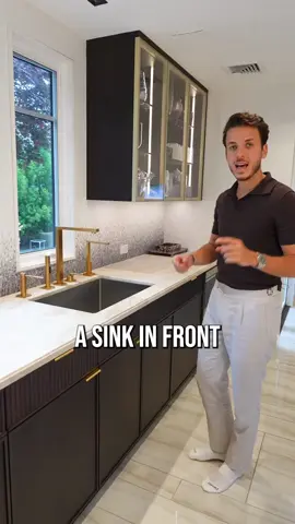 Hey, the kitchen guy has this rule: no cabinets in the way of the sink! We totally prefer to have a window right above it instead!