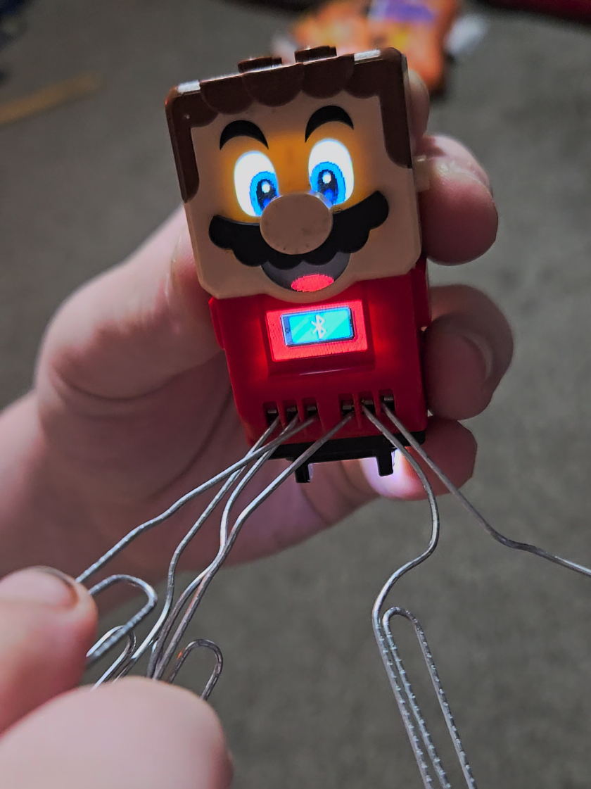My son came into my room with this contraption. I guess he was bored 🤣🤦‍♀️ (also before anyone says anything, I know his nails are dirty, he just came in from outside 🤷‍♀️)  #Mario #Lego #Lego Mario #funny #fyp 