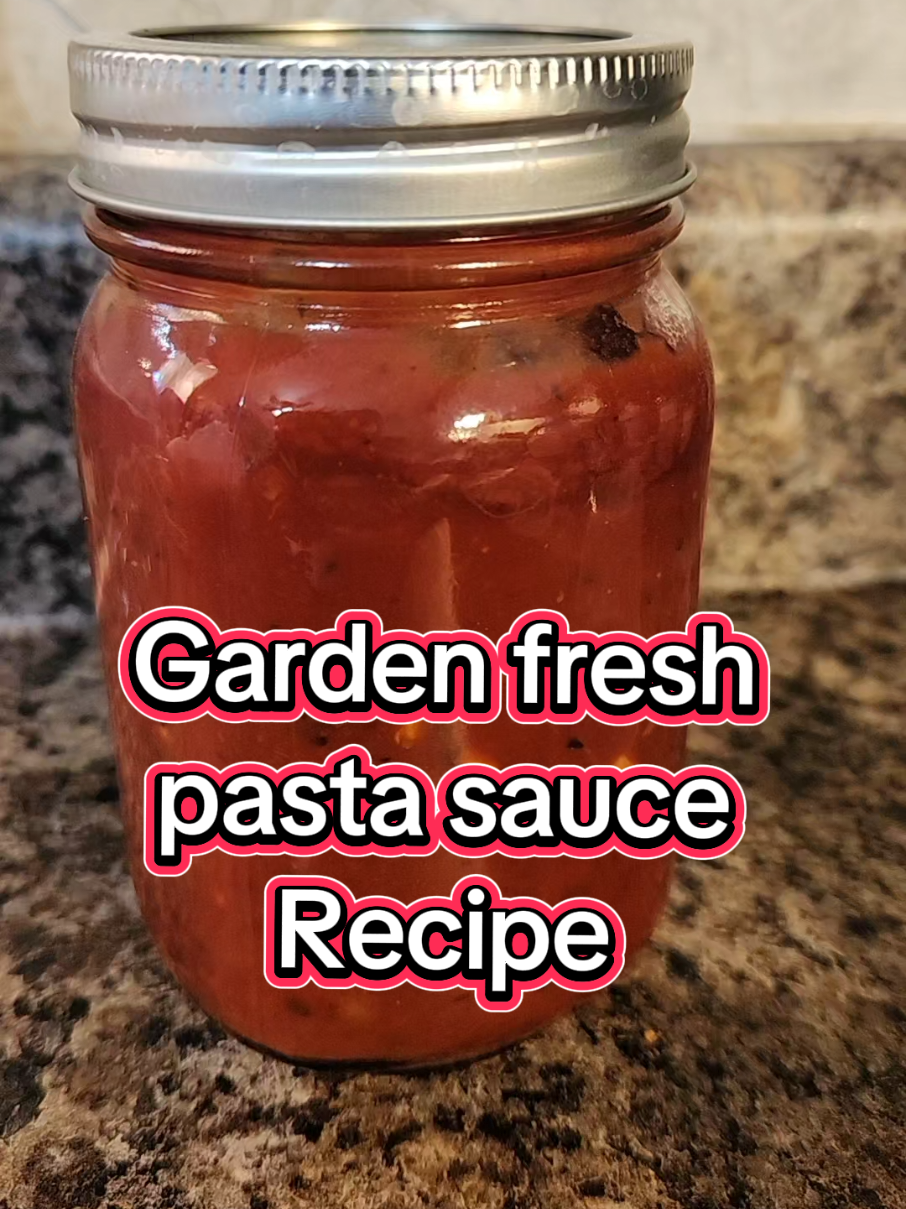 Preserve summer in a jar! Just canned the BEST pasta sauce with garden tomatoes, basil & garlic.  Simmer, jar, and water bath for shelf-stable goodness. 1. Cut tomatoes into halves and place on a sheet pan.  Add the whole head of garlic that you cut in half. Also, add the onion to the sheet pan. 2. Drizzle on olive oil and season with a little salt and pepper. Mix the veggies and toss with olive oil. 3. Roast in a 350-degree oven for 30 minutes. 4. Remove the sheet pan from the oven. Allow the tomatoes to cool for about 15 minutes. 5. In a food processor, add tomatoes and onions. Squeeze out the garlic cloves into the sauce. 6. Add in the herbs and spices. 7. Pulse several times until you get the desired cut on your tomatoes. 8. For a chunkier sauce, pulse fewer times. For a finer sauce, continue pulsing until everything has been minced finely. 9. Add everything to a saucepot and simmer on low for at least an hour. 10. can or serve with your favorite pasta meal #fresh #garden #pastasauce #dinner #canning