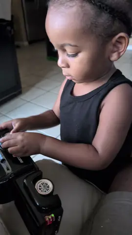 My grandson,working on a flat tire on his truck !!!!
