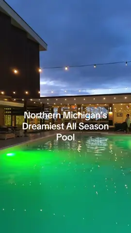 Swimming outside while the snow falls >>> 🏊‍♀️❄️ The all-season pool at @delamartraversecity is unreal — summer vibes in July, blizzard swims in January. Northern Michigan doesn’t play when it comes to bucket-list travel moments. ✨