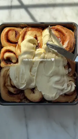 Another day, another bake 🥴 patiently waiting for it to be fall already #cinnamonroll ingredients FOR DOUGH 525g bread flour 10g salt 85g granulated sugar 6g dry yeast 145g whole milk 100g cold water 160g heavy cream 50g unsalted butter FOR FILLING 80g unsalted butter 140g brown sugar 25g granulated sugar  2 tsp + 1/2 tsp cinnamon 1/4 tsp + 1/8 tsp salt  FOR BAKING  80g heavy cream 55g brown sugar 1/4 tsp salt FOR CREAM CHEESE FROSTING  220g cream cheese 1 1/2tsp vanilla extract 60g powder sugar 20g heavy cream 60g unsalted butter  PROCESS For dough  In a large mixing bowl, combine bread flour, salt, granulated sugar, and dry yeast. Stir until well combined. Add milk, cold water and heavy cream. With a stand mixer on medium-low speed, knead for 8 minutes. Add butter and continue kneading for an additional 20 minutes. Alternatively, knead the dough on a floured surface for 8-10 minutes until smooth and elastic. Place the dough in a greased bowl, cover with a damp cloth, and let it rise in a warm place for 40 minutes. Preheat your oven to 350°F (175°C). Once the dough has risen, punch it down and roll it out on a floured surface into a large rectangle, about 1/4 inch thick. For filling  In a small bowl, mix together the brown sugar, salt,  unsalted butter and cinnamon for the filling. Spread the cinnamon mixture over the dough, leaving a small border around the edges. (optional: you can cut the dough into strips, using a pizza cutter and then tightly roll them in) Starting from one long edge, tightly roll up the dough into a log. Cut the log into 8 – 12 even slices using a sharp knife or a piece of unflavored dental floss. For baking  In a small bowl, combine heavy cream, brown sugar, and salt, mixing until well combined. Pour the mixture into a buttered baking pan Place the rolls in a greased baking dish, leaving a little space between each roll. Cover the rolls with a towel and let them rise for another 30 minutes. Once the rolls have risen, bake them in the preheated oven for 35 minutes or until they are golden brown. Remove the rolls from the oven and let them cool slightly while you make the frosting. For frosting  In a medium mixing bowl, beat together the cream cheese, unsalted butter and powdered sugar until smooth and creamy. Add the heavy cream and vanilla extract. Beat until well combined and creamy. Once the cinnamon rolls have cooled slightly, spread the cream cheese frosting generously over the top of each roll. Serve the rolls warm and enjoy! #fallbaking #bakewithfreya #desserts 