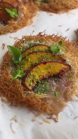 These Kataifi Peach Tartlets are as stunning as they are simple. Just toss a packet of kataifi with a stick of melted butter until it’s golden and glossy. Shape little nests on a baking sheet, tuck in some creamy Violife Greek-style vegan feta, layer with juicy peach slices, and bake at 365°F for 20 minutes. Once they’re crisp and golden, finish with a drizzle of agave and a sprinkle of crushed pistachios. 🥰 The result? A flaky, sweet-savory bite that feels gourmet yet takes almost no time to pull together. Perfect for weeknights or when you need a last-minute showstopper. #desserts #Recipe #dubaichocolate #peaches 