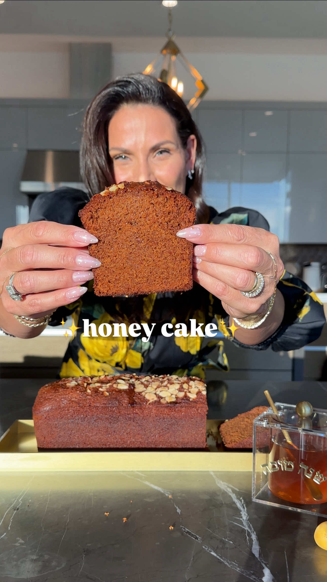 🍯✨ HONEY CAKE ✨🍯 This is the winning holiday honey cake recipe 💛 Save this for Rosh Hashanah prep.  ✨ Honey cake domes + honey jars (plus more Rosh Hashanah items) available now in my holiday collection at sivanskitchen.com — link in bio ✨ Loaf pan size: 12x4 inches Ingredients: • 1 cup brown sugar (150 g) • 3 large eggs (room temp) • ¾ cup neutral oil (188 ml) — avocado, grapeseed, or canola • 1 cup honey (250 ml) • 2½ cups all-purpose flour (385 g) • 2 tsp cinnamon (6 g) • ¾ tbsp baking powder (10 g) • 1 tsp baking soda (6 g) • 1 cup strong black tea (250 ml, from 2 tea bags — Earl Grey or English Breakfast, can be decaf) • ½ cup sliced raw almonds • Extra honey for drizzle 🍯 Method: 1️⃣ Brew 1 cup of strong tea with 2 bags. Let cool. 2️⃣ Whisk eggs until frothy, then whisk in brown sugar. 3️⃣ Add oil, then honey (tip: measure oil first so honey slides out easily). 4️⃣ Sift in flour, cinnamon, baking powder + baking soda. Mix until combined. 5️⃣ Slowly stir in cooled tea until batter is smooth. 6️⃣ Grease pan, pour in batter, tap to release bubbles. 7️⃣ Sprinkle almonds on top. 8️⃣ Bake at 350°F (175°C) for 35–40 min, until toothpick comes out clean. 9️⃣ Cool, then drizzle or brush with honey before serving 🥰 #sivanskitchen #fyp #EasyRecipes #honeycake #RoshHashanah 