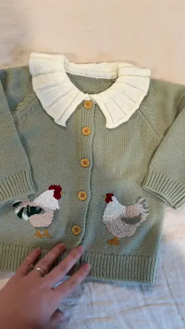 This is the absolute cutest toddler cardigan I’ve ever seen. The roosters are so cute and the knit collar with the wood buttons are the perfect added details! It fits true to size and is a must have for the fall! #cardigan #toddlerfashion #chickens #toddlergirlfashion #chickensweater  @BabyFocus 