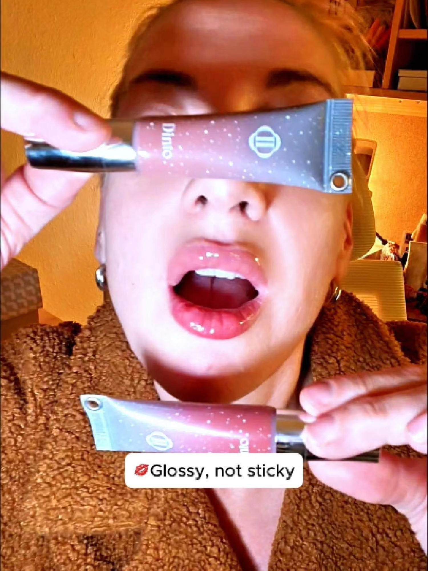 A gloss that actually feels refreshing. ❄️ Dinto Frozen Jelly Gloss gives lips a subtle minty tingle for gentle plumping, with a cooling metal applicator that instantly soothes and smooths. It’s glossy without the sticky mess, hydrating like a balm, and leaves lips looking full and juicy. 💋 A quick swipe and you’ve got hydration + shine in one step.  I'm wearing #376 Mirror on my bottom lip and #374 Dove on my top lip. They're just as lovely all smushed and blended together. :) @dinto.cosmetic @dinto.usa #dinto #lipmakeup #lipgloss #kbeauty #kbeautybrand