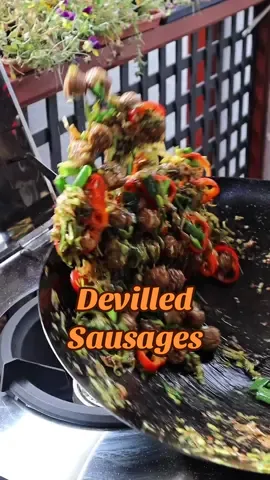 Devilled Sausages Your next week night fav! Recipe  1/2 onion sliced  1 tbsp garlic paste  1/2 leek shredded 1 red bull horn chilli  6-8 sausages cut into desired shape  1 tbsp soy sauce 1 /2 tsp salt  1 tsp cracked black pepper  1/2tsp sugar 1 tbsp chilli paste (I have a recipe on reels) or chilli flakes  2 spring onions  1 tbsp sesame oil  Optional - tomato sauce and MSG 1) in a wok or a large frying pan saute onion and garlic in some oil until fragrant  2) Add in the sausages and cook for 6-7 mins until they are nearly done  2) Add in leek, soy sauce, salt, pepper, chilli paste/chilli flakes and cook for 2-3 mins until leeks are translucent  3) In goes the bull horn chilli, spring onion and sesame oil and on high heat cook for about 2mins. Enjoy with some fried rice!  #wok #sausages #devilledsausages #dulan 