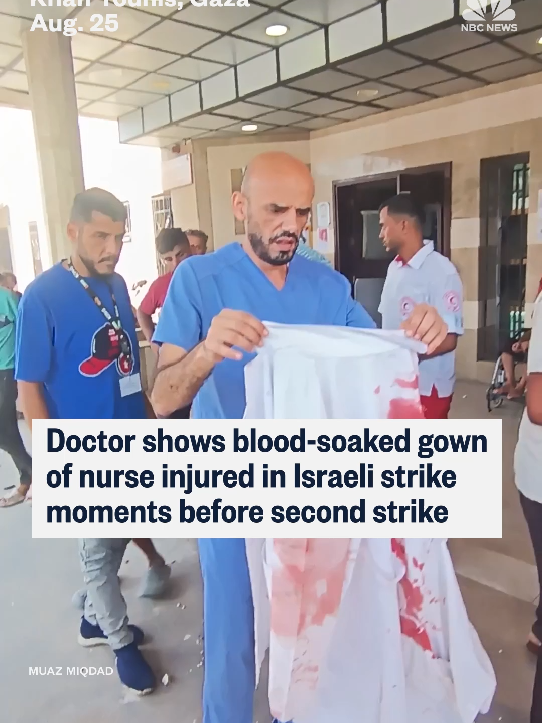 Dr. Mohammad Sukkar, the head of nursing at Nasser Hospital in #Gaza, held the blood-soaked gown of a nurse who he said was wounded in the first of two Israeli strikes at the hospital. While he is speaking, the second strike hits Nasser. #Israel says it is investigating the strikes. PM #Netanyahu called the incident a “tragic mishap.”