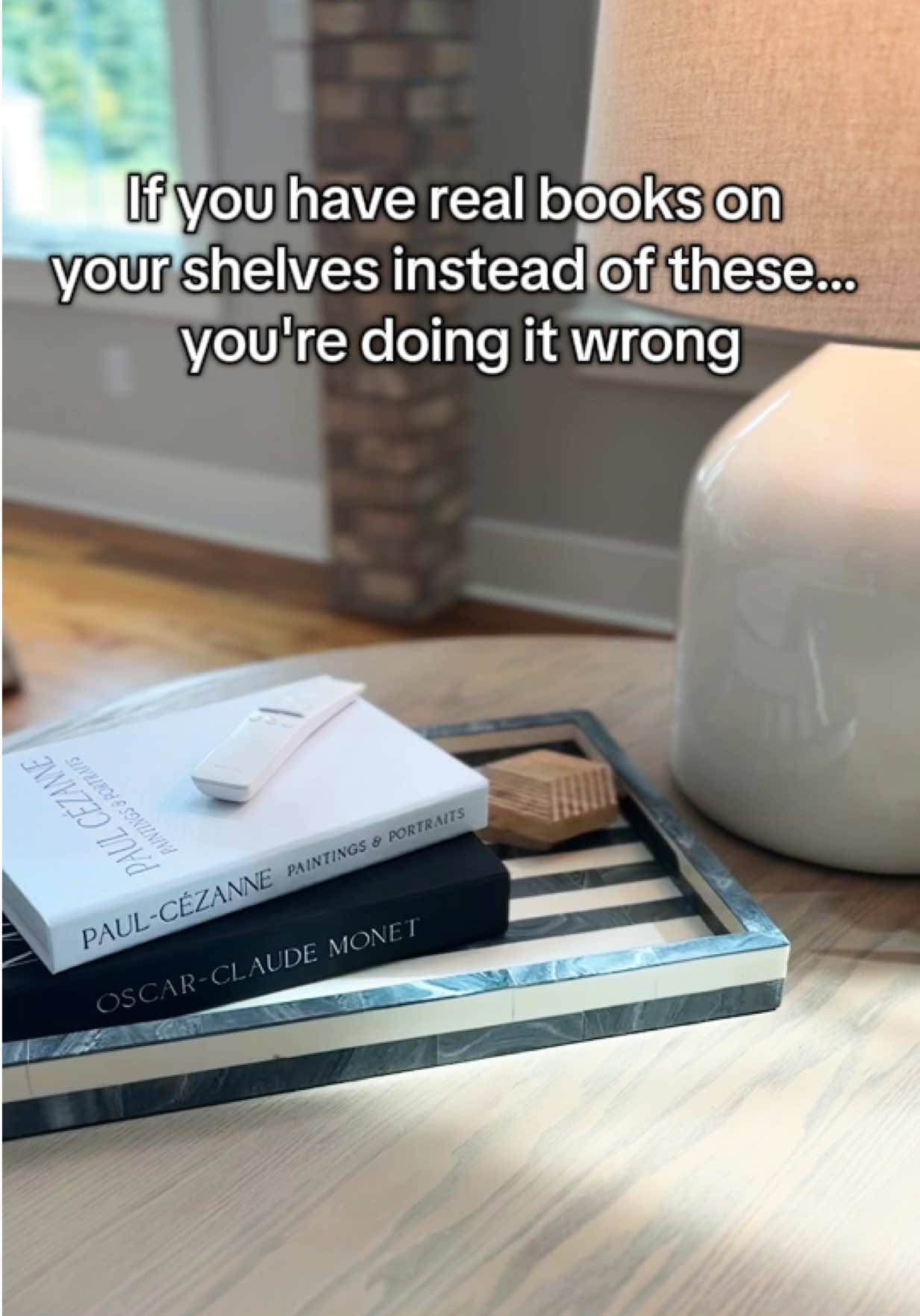 Small space, big design energy — fake books are the real MVP. 🙌  ShelfStyling #DesignTips #HomeStylingHacks #FauxBooks #DecorHack #MinimalistHome #InteriorInspo #books 