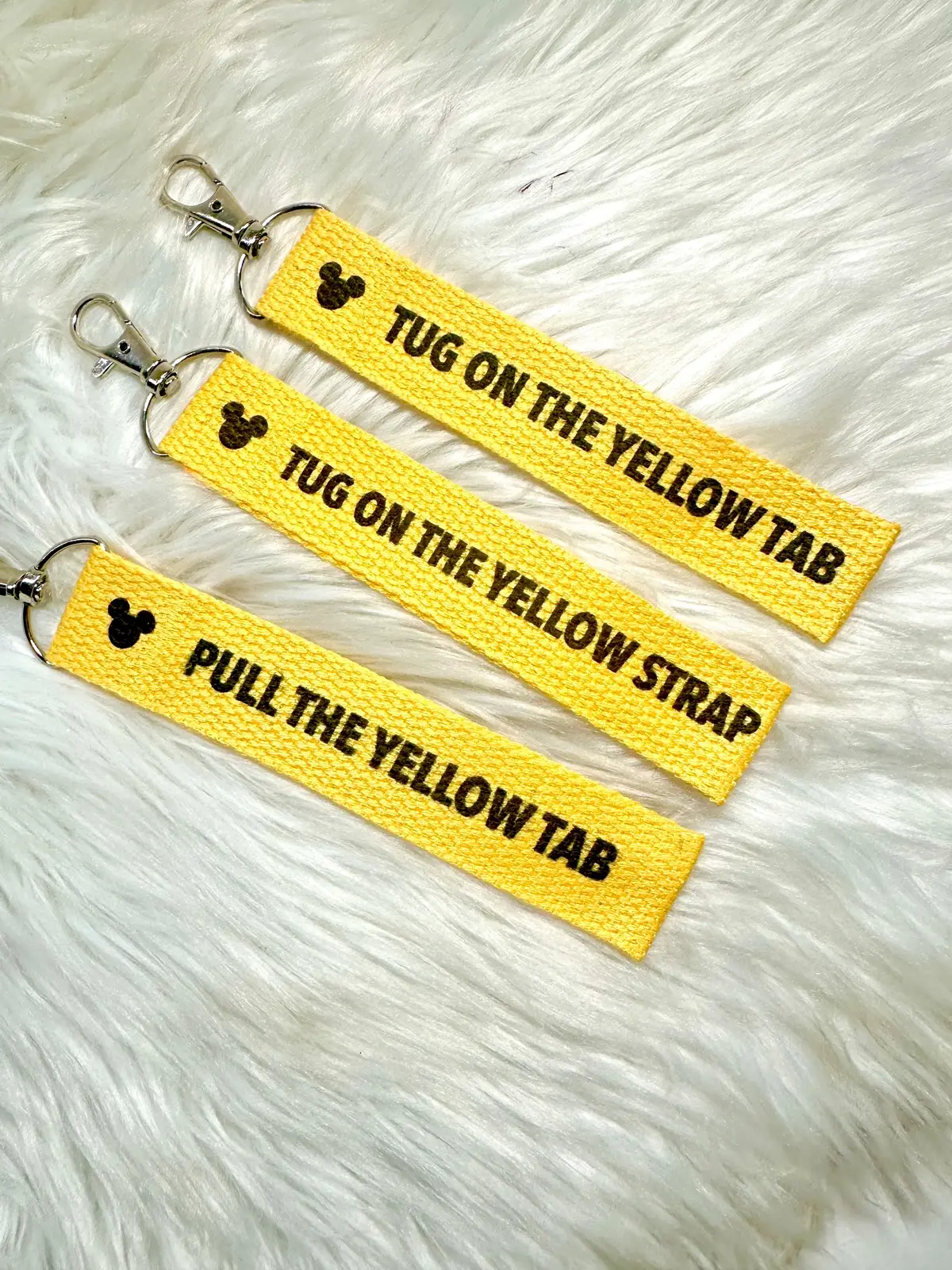 Had to change the saying since someone decided to trademark a phrase which you are not supposed to do! But that’s ok! Made these a little cuter and you can choose which phrase you like or hear more often! I swear I always hear something different each time I go lol. ##pulltheyellowstrap##pulltheyellowtab##disney##disneykeychains