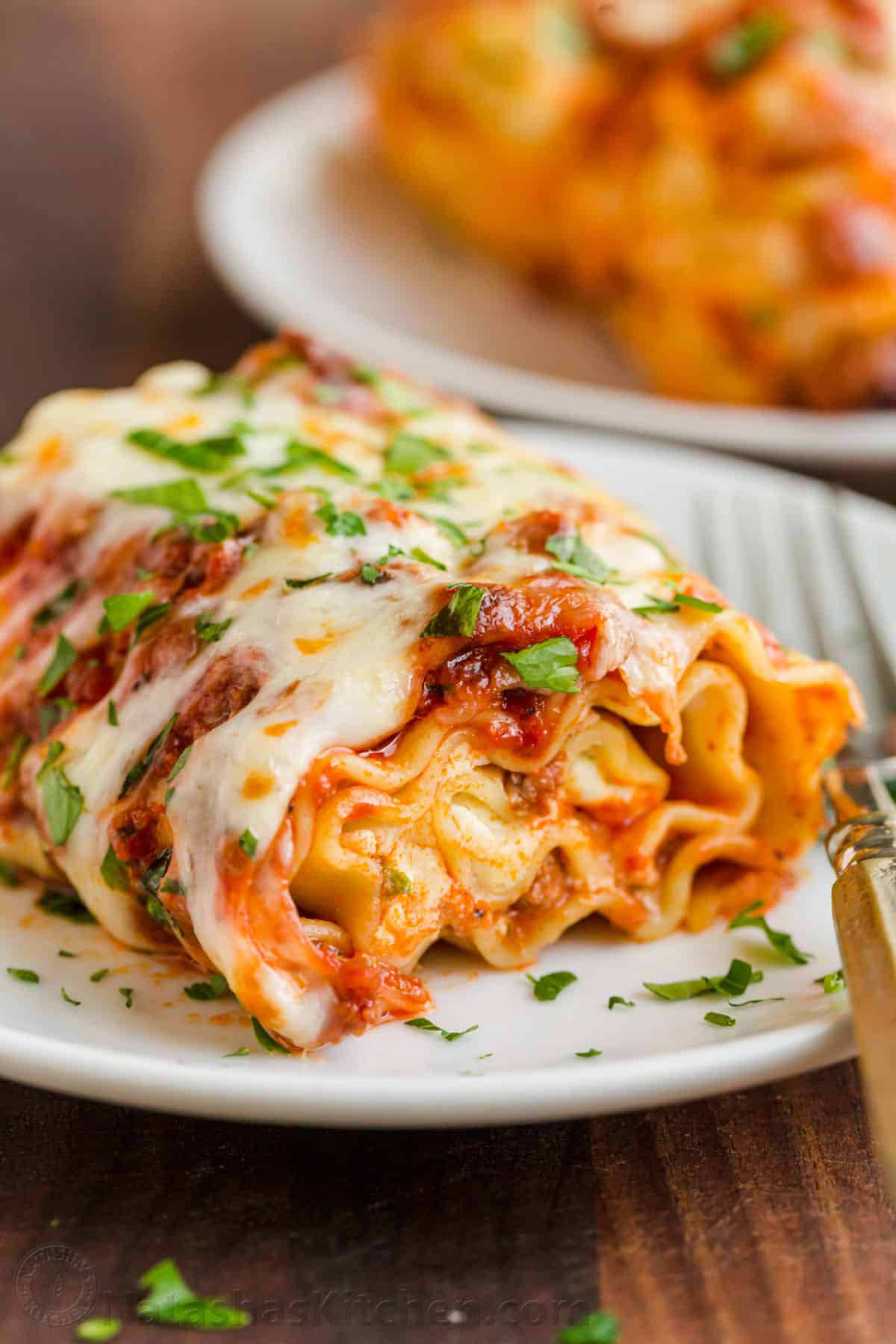 Lasagna...but BETTER 👀 Easy Lasagna Roll Ups: https://natashaskitchen.com/lasagna-roll-ups/ #lasagna #lasagnarollups #italianfood #pasta #casserole 