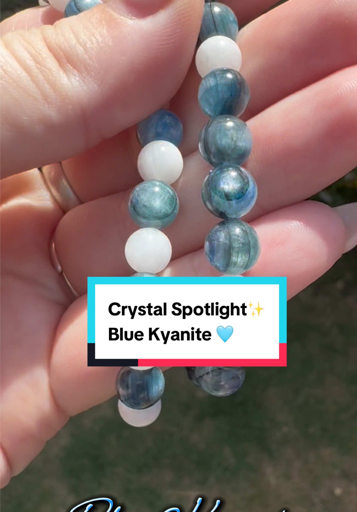 ✨Crystal Spotlight✨ Today I am spotlighting beautiful ✨Blue Kyanite✨. You’ve probably all heard of it. Or have random pieces of dusty blue needle like raw pieces you’ve acquired here and there. But many of you won’t have ever seen it in all its glory or paid much attention to it. This is gemstone grade AAA kyanite. When polished up like this, high grade kyanite presents like the classic mica mirror flash for similar reasons. It forms in needle like layers and so when polished up, as the light reflects through these BAM our eyes see this gorgeous blue/silver flash reflection. I am so drawn to it at the moment, I think she’s stunning. Poor old kyanite is often thought of as quite a dull crystal to have and most people are unaware that high grade looks like the beauty you see here. She is an epic healer, but she won’t coddle you like a rose quartz, she will propel you forward and move all of the rubbish out of your path. This girl is straight to the point as a healer. She doesn’t hold any negativity, any that approaches, she will disperse right away from your energetic field. Don’t be scared by her direct methods. She’s just muting the excess noise, she is pinging you back into alignment. She’s special as she will align all chakra energy centres at once, she thrives everywhere. If you can imagine being tapped with a tuning fork, how you would feel. That is blue kyanite. She’s direct, she’s truthful and she is willing to help those of you who struggle with those good boundaries, who can’t shut out the emotional noise around you, her colour of blue means that how she works in the throat chakra is steadying that voice with confidence whilst you say what is not okay with you. As an openly neurospicy individual she works great when those nervous systems are burnt out and you just need to regulate in solitude and want the world to leave you in peace. She’s just like the direct friend you go to as you can always rely upon them for a truthful answer. I am hoping you all understand the “bend & snap” reference from Legally Blonde. But if not what I mean by that is that’s what she does to your energy centres. She bends them and then snaps them right back into place. This reference will help you remember one thing about this stone long after you’ve watched this video. Let me know what your feelings are towards blue kyanite, is she pulling you in or do you find her directness intimidating. I am a BIG fan. But let me know in the comments. And keep your eyes peeled for when she launches in the shop 🌙🔮🩷✨ #crystalhealing #fyp #crystals #crystalshop #crystalbracelets 