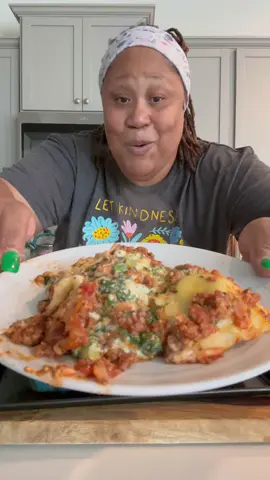 3 lbs. ground beef 1 tablespoon OooWee All Purpose Seasoning 1 tablespoon Onion Powder ! Tablespoon Garlic Powder  1 onion chopped  1 teaspoon garlic  1 tablespoon tomato paste 2 tablespoons Italian seasoning 1-28 oz can crushed tomatoes  1 cup water Salt and pepper to taste  1 tablespoon sugar 1 bag frozen spinach 12oz  32 oz ricotta cheese  1 egg 1 cup mozzarella cheese  1 cup parmesan cheese  1/2 cups mozzarella cheese (for topping) 1/2  cup parmesan cheese (for topping) 2 - 18oz bag spinach and ricotta ravioli Oven temo 350  Cooking Time 35 to 40 minutes uncovered  #yummy #delicious #Raviolilasagna