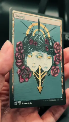 This is my take on this months Monthly MtG Alternate-art Challenge! This months prompt was flowers and they are finally done! We are embracing our happy accidents on this one with the gold leaf being friggen everywhere except where I wanted it… but it’s okay cause happy accidents. X.x This one was a ton of fun cause I got to really show off my art style, use several techniques I’ve learned, and give y’all an idea of just how much I love me the weird and spooky. I could legit spend 10+ more hours on this to absolutely perfect it but I’m calling it here so it can go to its new home tomorrow!  We love to embrace the dark, spooky, and gothic vibes around here so this one really hit the spot and the mental refresh button so I can get back to comissions after one of the longest months of my life. 🖤💀🖤 If you an alter artist and I haven’t snagged you yet to come join the fun each month def hit me up or comment so I can drag you into the tiny corner of TikTok we’ve slowly been building up for all us creative weirdos. 🖤🖤🖤    #mtgalter , #gothaesthetic, #vibe, #darkvibes, #magicalteredart 