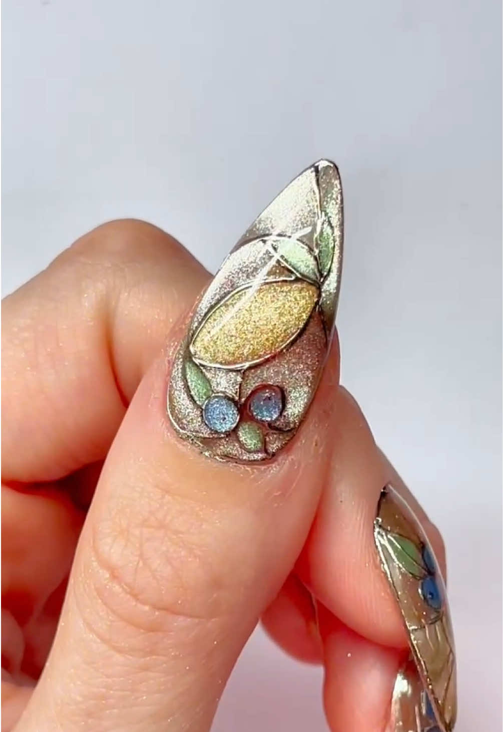 ✨🪞 Chrome Stained Glass Nail Tutorial 🪞✨ Adrianna is serving ethereal vibes with this dreamy look - all using Tickled Pinque Cosmetics 💖🎀 Here’s what you’ll need: 💅 Mirror Powder in Champagne Silver 🌹 Rose Dust Brush 🌈 A variety of Cat Eye Colour Gels 🖤 Black Gel Paint for striking outlines and definition ✨ Top Gloss for that flawless finish Think stained glass… but make it PINQUE & next-level gorgeous 💫 The result? Chrome perfection that’s as magical as it is mesmerizing 💕 @adrianna 🌸 #TickledPinqueTutorial #ChromeNails #StainedGlassNails #EtherealNailArt #NailGirlMagic