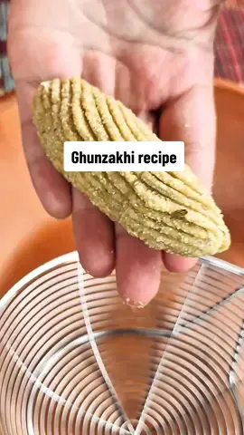 gunzakhi recipe #fyp #foryou #foryoupage #Recipe #ghunzakhi #kpk #pashtun #traditional food  Ingredients  For Sugar Syrup (Sheera ) 2 cup water 400 grams sugar ( I have added very less sugar u should add according to ur taste 🤓🫡)  Ghunzakhi Dough 1 kilo Flour ( atta) 1 kilo semolina  1 tbsp fennel seeds  1 tsp baking soda  8/9 green cardamom  1 cup shredded coconut  4 eggs  1/2 cup ghee 4 tbsp sugar  For Frying: Ghee or oil – enough for deep frying