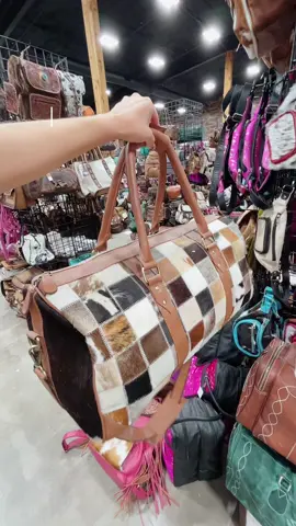 Discover our stunning collection of tooled leather and cowhide duffle bags, perfect for travel or everyday use. Style meets durability in every piece! Western-linens.com #fyp #tooledleather #dufflebag #suede #cowhide #patchwork 
