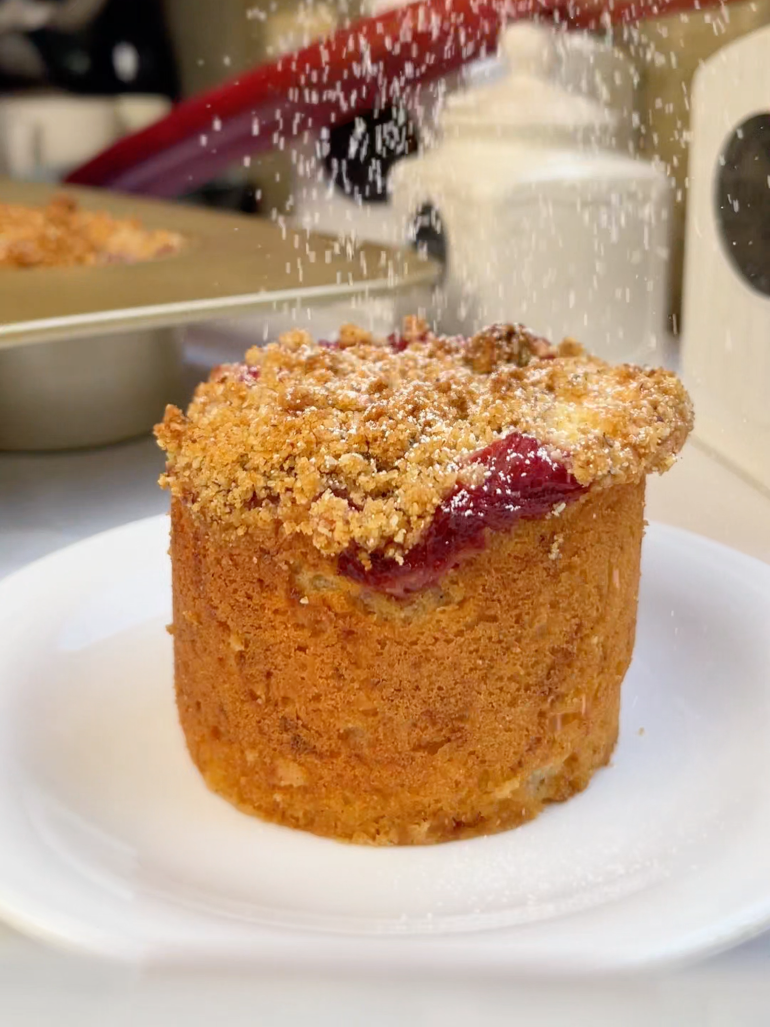 Mini Rhubarb Crumb Cake with Almond Streusel A tender, spiced cake layered with jammy rhubarb compote and topped with a buttery almond streusel. It’s moist, flavorful, and perfect for make-ahead baking. Ingredients Rhubarb Compote - 5 cups chopped rhubarb (500 g, trimmed) - ¼ cup granulated sugar (50 g) - Zest of 1 lemon - Juice of 1 lemon Cake Base - 1 cup + 2 tbsp Labneh or Greek yogurt (275g) - ½ cup granulated sugar (100g) - ¼ cup packed dark brown sugar (50g) - 2 large eggs  - ⅓ cup butter, melted (80g) - 2 tsp vanilla bourbon paste (or vanilla extract)  - 1½ cups all-purpose flour (190g) - ¾ tsp baking powder - ½ tsp baking soda - ½ tsp ground cinnamon - ¼ tsp salt Almond Streusel Topping - 1¼ cups all-purpose flour (150g) - 1 cup packed dark brown sugar (213g) - ½ cup almond meal (113g) - ½ tsp ground cinnamon - 1¼ tsp salt (6g) - ½ cup cold unsalted butter, cubed (113g) Method Rhubarb Compote 1. Rinse and trim the rhubarb, then cut into 1–2 inch pieces. 2. Place rhubarb, sugar, lemon zest, and lemon juice into a medium saucepan. 3. Cover and cook over medium-low heat for about 5 minutes, or until it begins to bubble. 4. Remove the lid and continue to cook, stirring every few minutes, until it becomes thick and jam-like. 5. Transfer to a shallow bowl and let cool to room temperature. Use the same day or refrigerate until needed. Cake Batter 1. Preheat oven to 350°F (175°C). Grease and jumbo muffin or mini cheesecake pan. 2. Wisk the eggs and granulated sugar, brown sugar until light and fluffy (ribbon texture) 3. Add the labneh (or greek yogurt), vanilla bourbon paste, and butter. 4. Sift in the flour, baking powder, baking soda, cinnamon, and salt. Stir until just combined. Do not overmix. 5. Pour the batter into the prepared pan . 6. Evenly spoon the cooled rhubarb compote over the top of the batter. 7. Add the Streusel over the top. Streusel Topping 1. In a medium bowl, rub the cold butter into the flour using your fingertips until crumbly. 2. Add the brown sugar, almond meal, cinnamon, and salt. Mix until the crumbs begin to hold together when squeezed. 3. Store in the freezer until ready to use. Extra streusel can be frozen for later. Bake & Finish 1. Sprinkle the cold streusel generously over the compote. 2. Bake for 40 to 45 minutes, or until the top is golden and a toothpick inserted into the center comes out clean.    *If using frozen rhubarb, the baking time may increase slightly. 3. Let the cake cool in the pan for at least 1 hour before removing. 4. Dust with powdered sugar before serving, if desired. #cake #cakes #cakesoftiktok  #food #Foodie #foodporn #instafood #yummy #dinner #foodphotography #foodstagram #foodgasm #delicious #homemade #cooking #foodpics #eating #happy #happiness  #Love #chef #FoodLover #foodblogger #eat #tasty #foodies #healthyeating #cleaneating #nutrition #wellness #fitfood #healthyrecipes #plantbased #baking #bakingrecipe #bakingszn #yummyfood #dinner #foodphotography #foodstagram #delicious