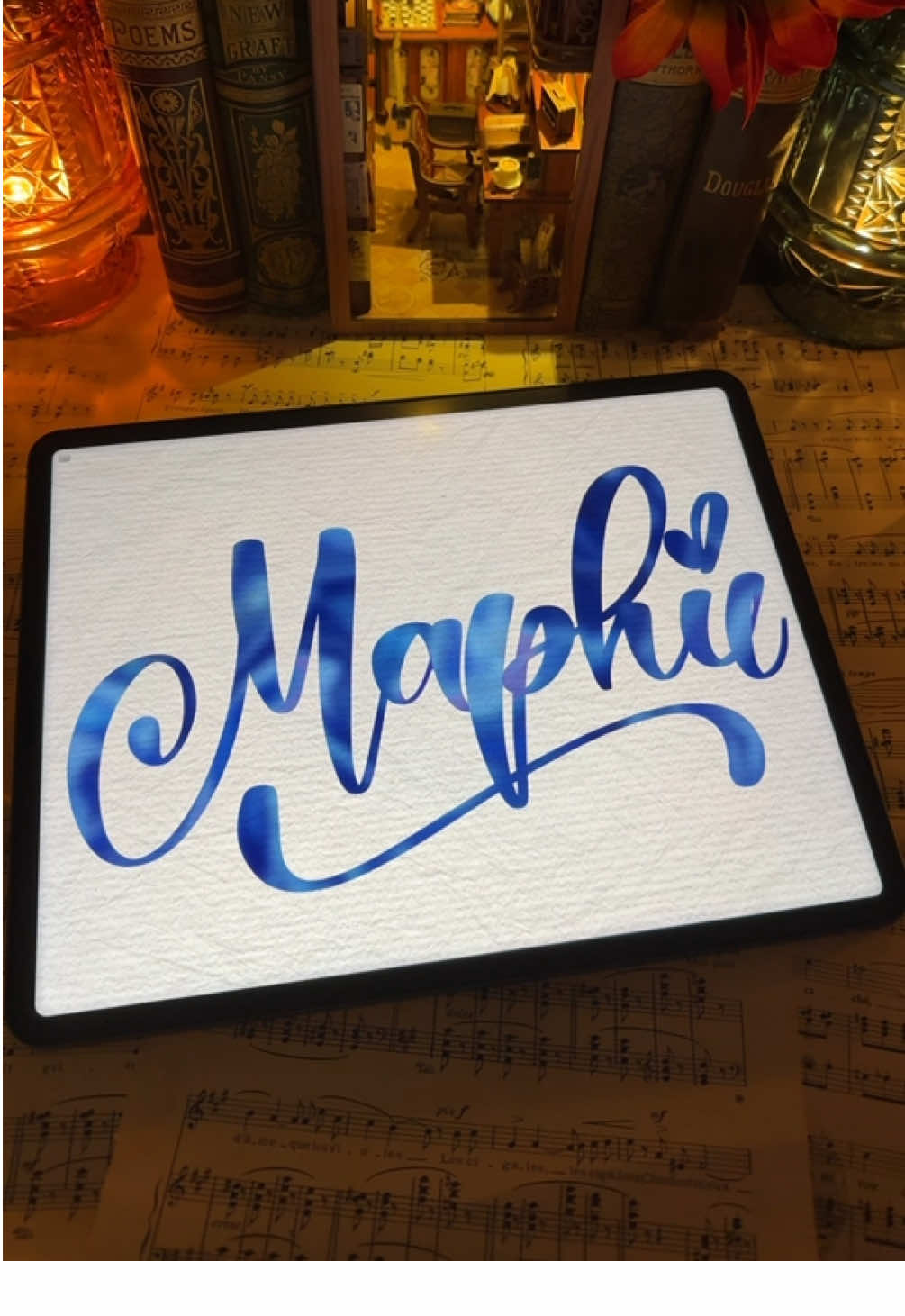 Replying to @𝗠𝗮𝗽𝗵𝗶𝗲™ I absolutely loved lettering Maphie!! 🤩🤩 I think it looks so pretty in this blue lettering! If you know someone who shares this name, please tag them in the comments and if there’s a name that you’ve been wanting to see me right in cursive, add that to the comments as well, for a chance to receive your own personalized name writing video. 🎁🎥✍️ #letteringwithamylea🖋️  #cursivewriting  #nameart✍🏻❤️🥰  #lettering #darkacadamiaaesthetic 