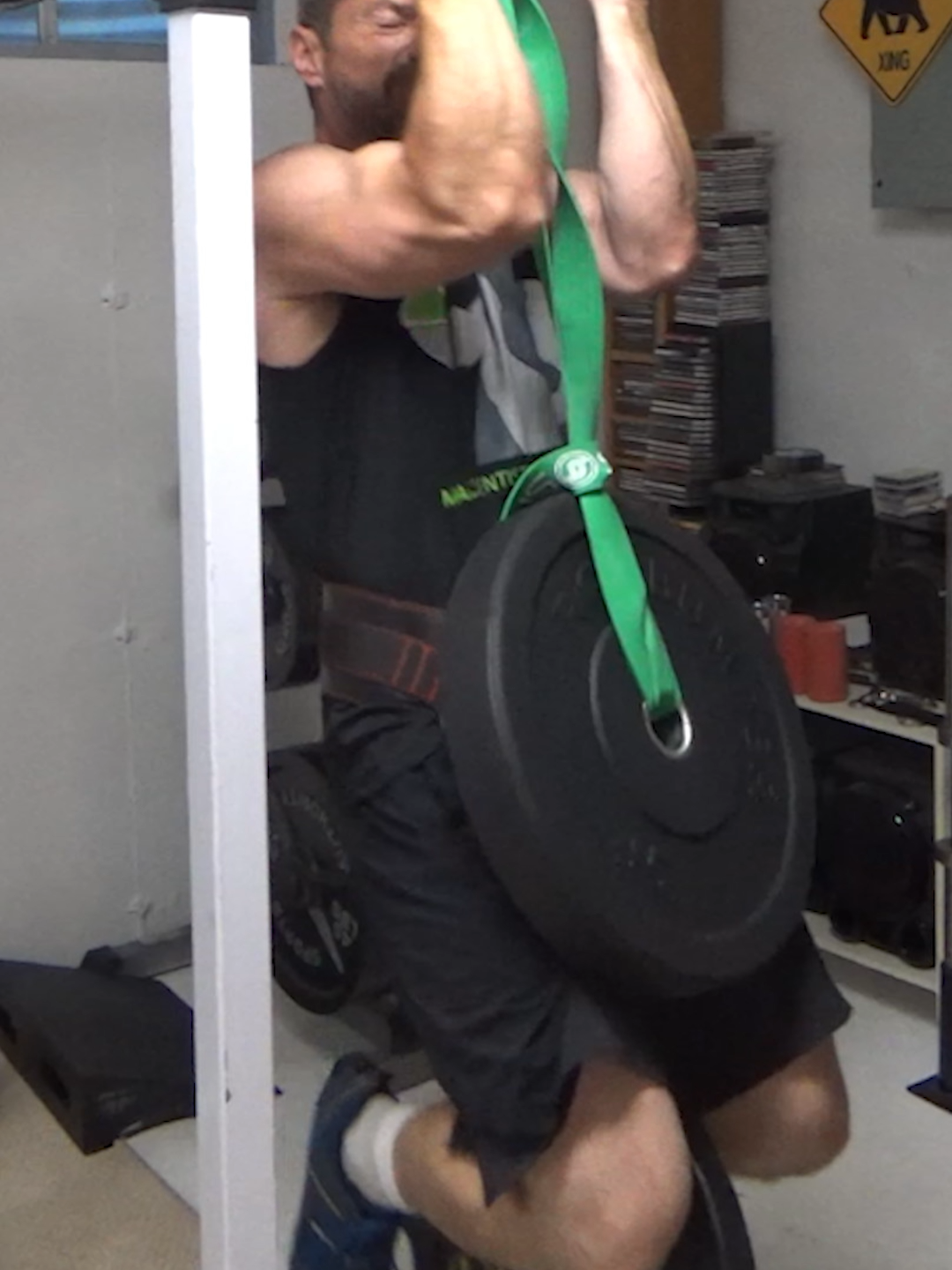 Get the popcorn ready for some serious badminton training... Weighted Hanging Band Wrist Rollers... this one is an absolute BEAST of a forearm exercise. It's awesome. I've got deep soreness right to the bone in my forearms today from it. This one doesn't hit fingers so much... primarily forearms. I posted the original of this one awhile ago using just bodyweight. And that one is brutal...so I decided to take it up a notch and add a 45 lb weight plate hanging from my waist. Essentially, I'm doing a plate wrist roller exercise (45 lbs) while hanging from the fat end of a barbell (counterbalanced on the other side with two 45's), with extra weight hanging on me.  This is a VERY advanced version of an excellent forearm exercise.  The 