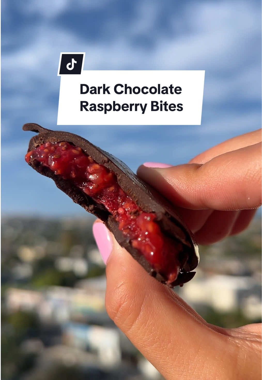 Dark chocolate raspberry bites🤤 Recipe👇 Ingredients  1-2 pints raspberries  2 tbsp chia seeds 2 tbsp honey  1-2 cups dark chocolate  1-2 tsp coconut oil Instructions  1. Line a baking sheet with parchment and clear space in your freezer. 2. Wash raspberries and mash in a medium bowl. Stir in chia seeds and honey until combined. 3. Spoon small dollops onto the baking sheet, flatten slightly, and leave space between each (I like to do a mix of sizes).  Freeze for at least 1 hour, until solid. 4. Once raspberry clusters are frozen, melt chocolate and coconut oil in a microwave-safe bowl in 30-second intervals, stirring until smooth. 5. Dip frozen raspberry clusters in chocolate, coat fully, and place back on the baking sheet. Freeze 10 minutes, or until chocolate hardens. 6. Store in a freezer-safe container for easy snacking.  #raspberrybites #raspberrychocolate #chocolateraspberry #EasyRecipe #healthydessert 